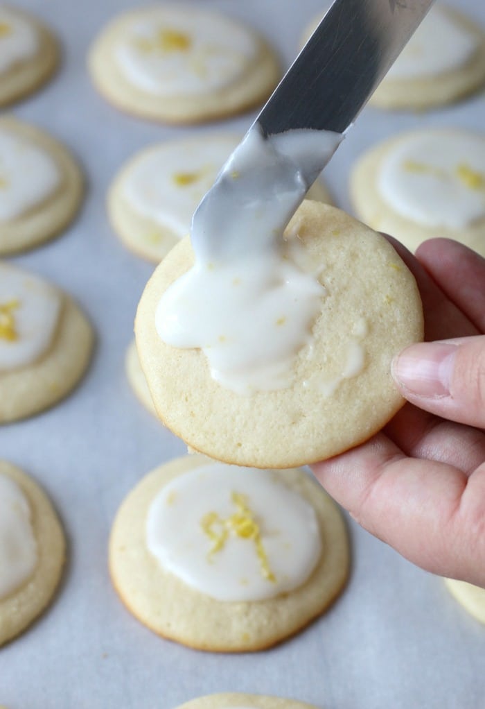 Here we see how the icing goes onto these delicious glazed lemon cookies.