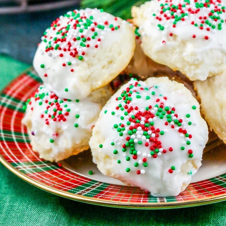 Soft and pillowy ricotta cheese cookies with a glaze topped with sprinkles.