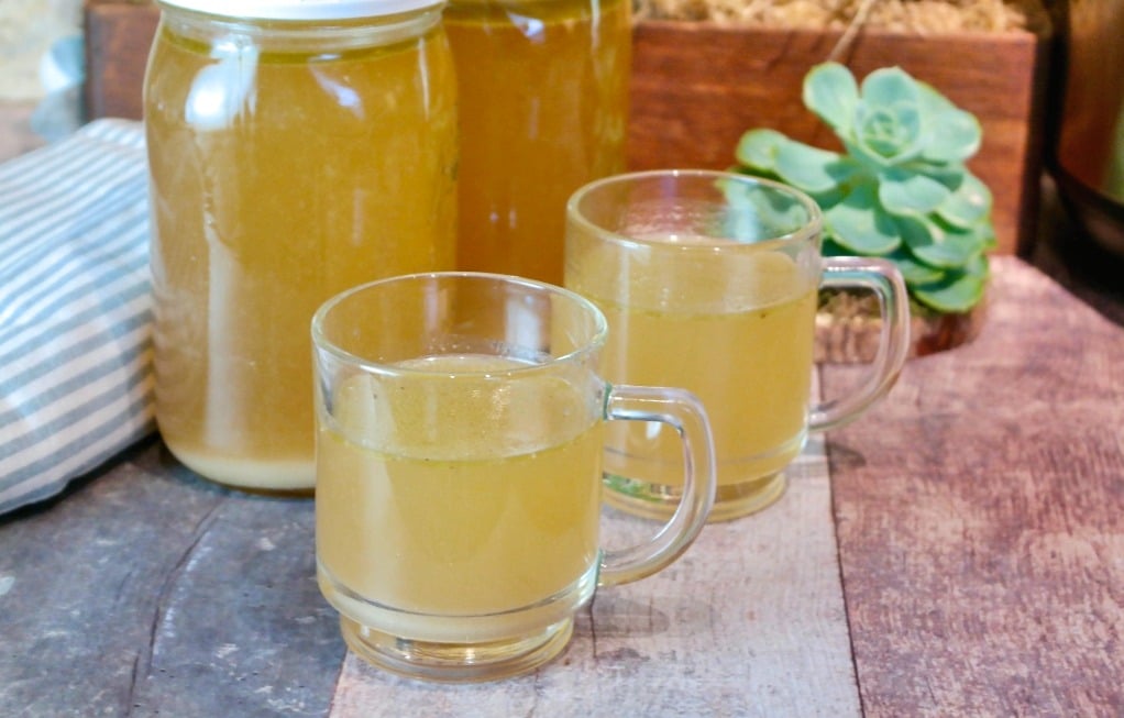 Two clear cups of turkey stock made in an Instant pot 