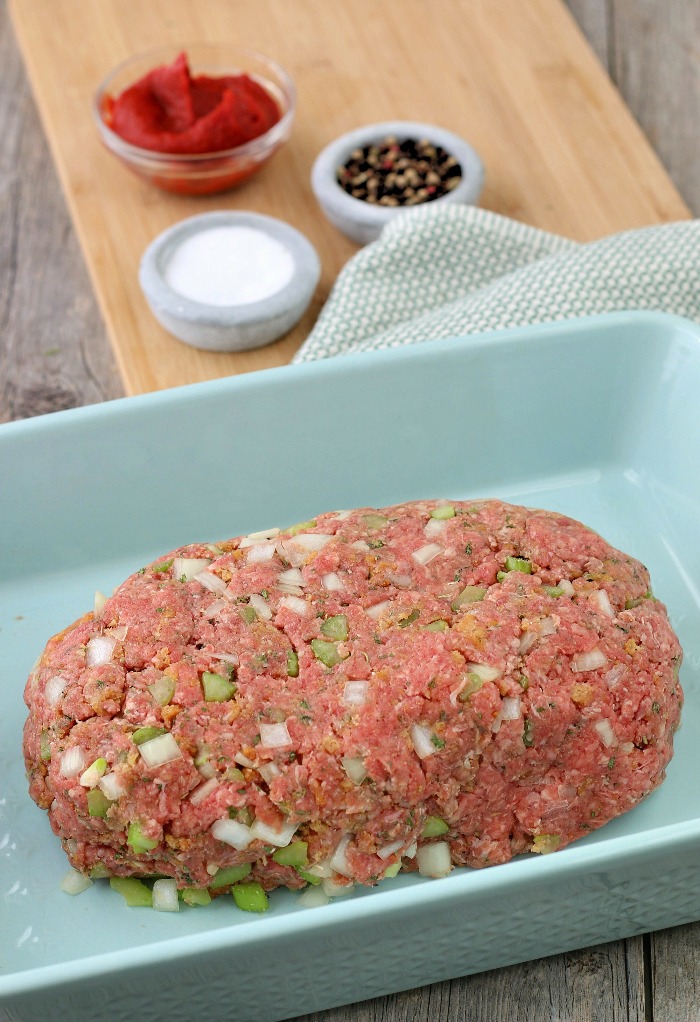 The keto meatloaf is formed and in the pan, ready to be baked. 