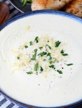 Creamy alfredo sauce keto sytle! This low carb sauce is delicious over zoodles or grilled chicken.