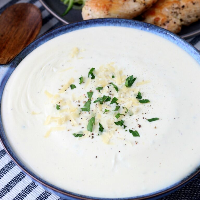 Creamy alfredo sauce keto sytle! This low carb sauce is delicious over zoodles or grilled chicken.