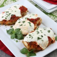 Keto chicken parmesan on a white serving platter.