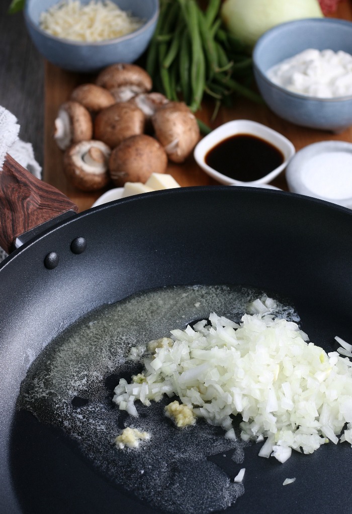 To begin making cauliflower shepherds pie we have to add the onion and oil to the skillet! 