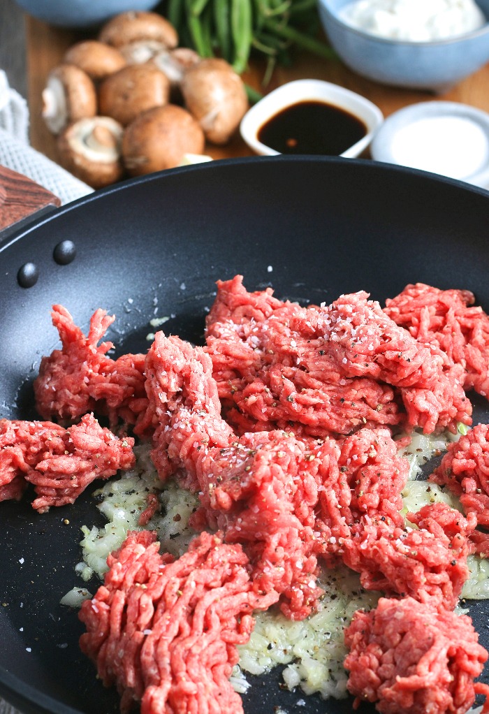 Next we see the ground beef being added to the skillet for keto shepherds pie. 
