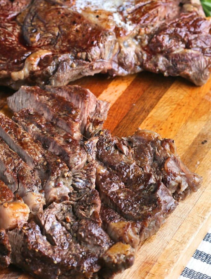 cooked steak on a cutting board