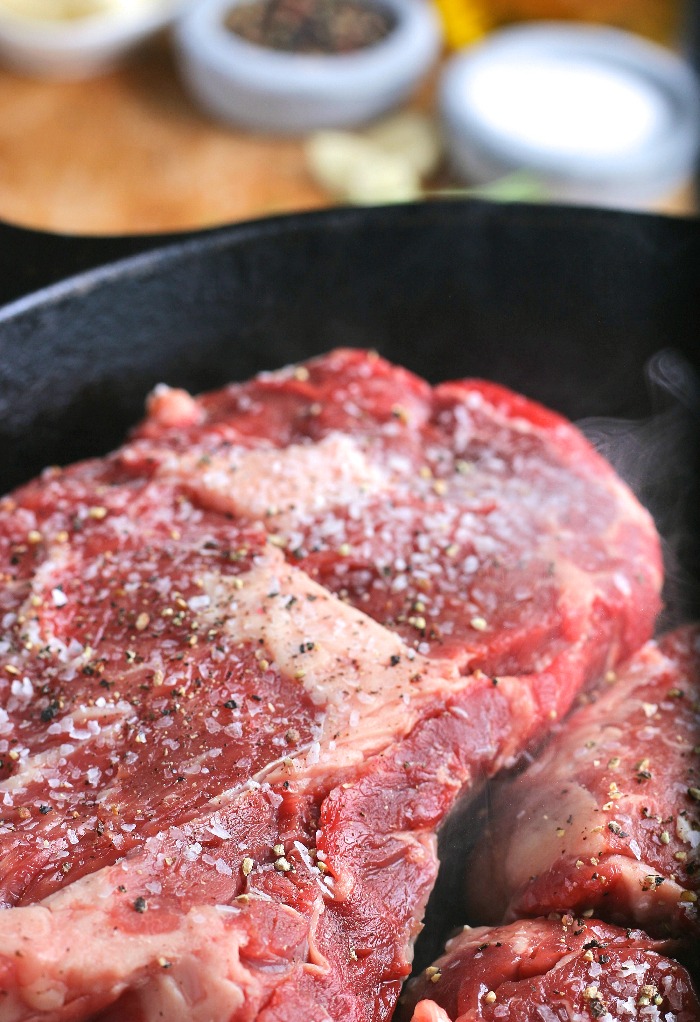 Here we see a close up shot of the steak in the pan before searing the top side. 