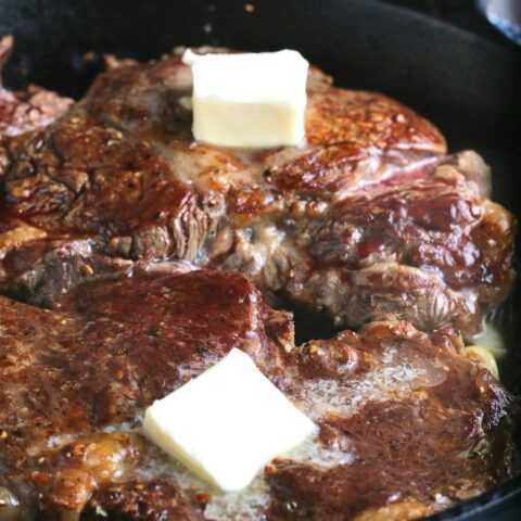 Adding butter when learning how to cook a steak in a frying pan is a great way to add flavor and keep the steaks from drying out.