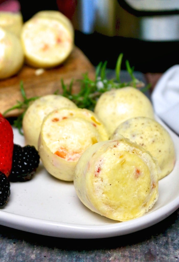 Cooked egg bites on a white platter ready to be eaten