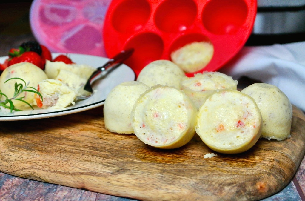 Egg bites recipe with cooked sausage and vegetables. 