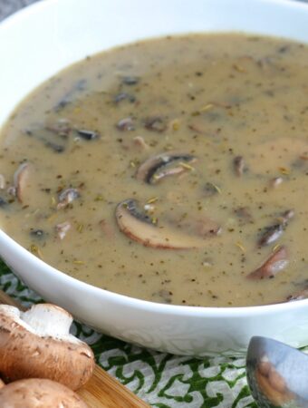 Full white bowl of mushroom gravy for topping steak, pork, or chicken