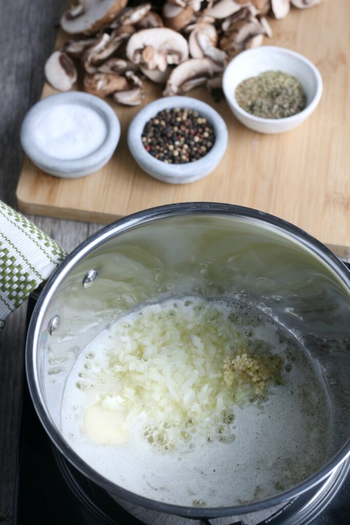 The first step for making mushroom gravy is to saute the onions with other seasoning. 