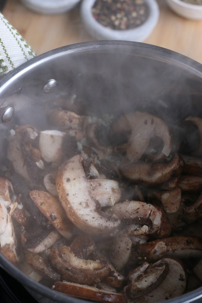 As the mushrooms start cooking we can see the mushroom sauce coming together. 