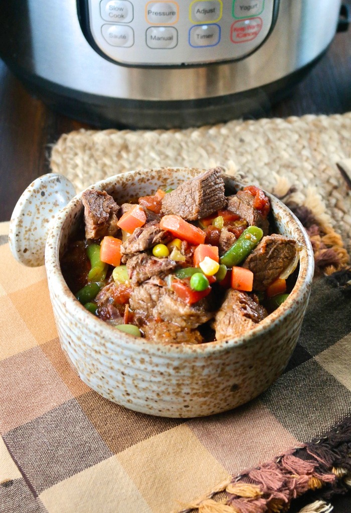 a bowl of beef vegetable stew cooked in an Instant Pot pressure cooker