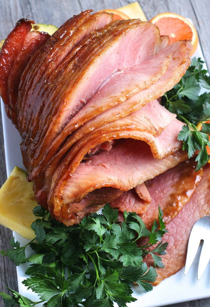 This image shows us the finished ham glaze recipe with brown sugar. The ham is sliced and ready to be served. 