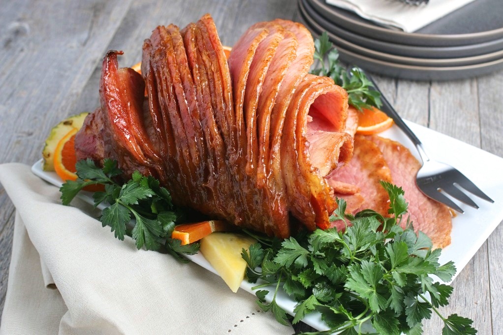 A horizontal view of the finished ham baked with a delicious brown sugar glaze. 