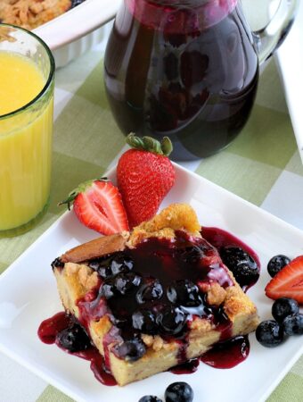 Brunch with a slice of blueberry casserole on a white plate