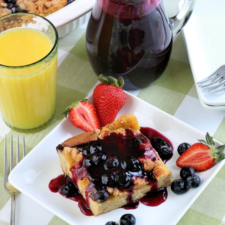 Brunch with a slice of blueberry casserole on a white plate