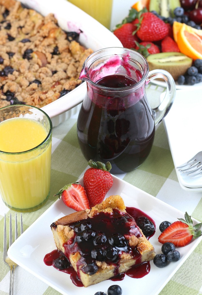 A complete French toast breakfast casserole with blueberry syrup