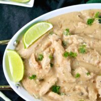 white platter of chicken with coconut cream and lime sauce