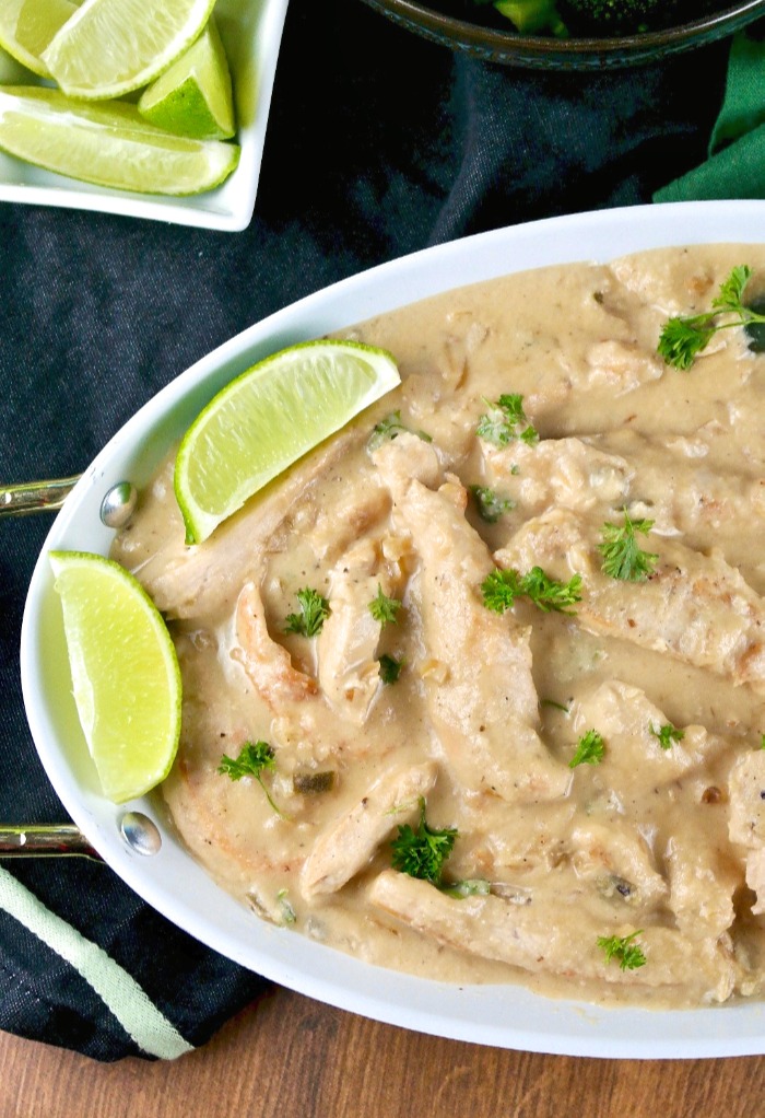 white platter of chicken with coconut cream and lime sauce