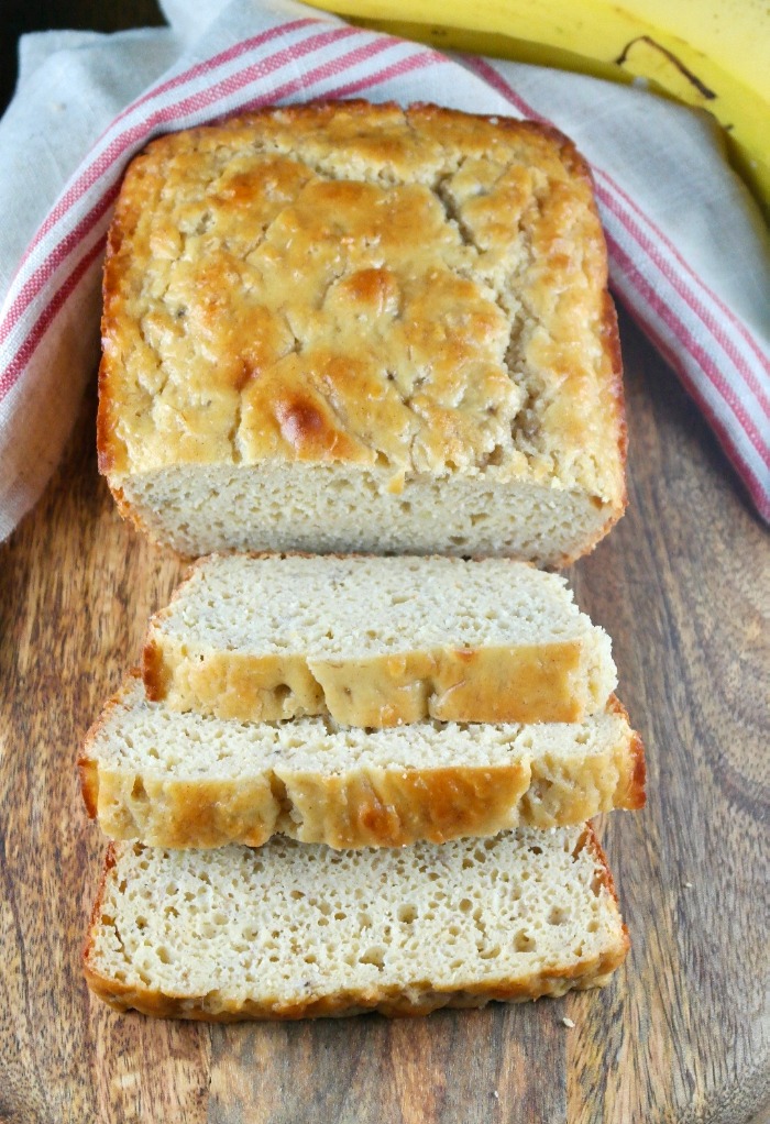 Sliced loaf of healthy banana bread on a cutting board