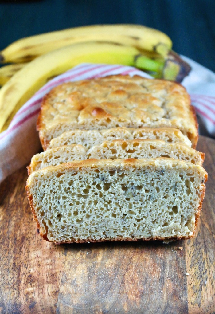 Sliced healthy banana bread on a cutting board