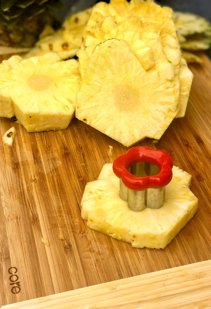 Cutting the core of the pineapple with a cookie cutter