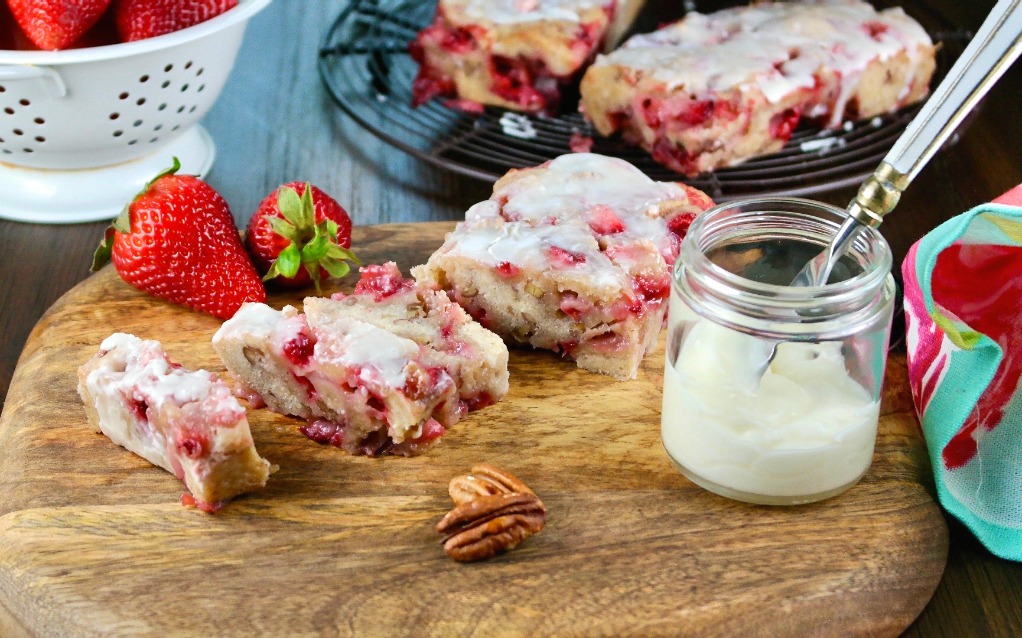 horizontal view of strawberry bread on a cutting board