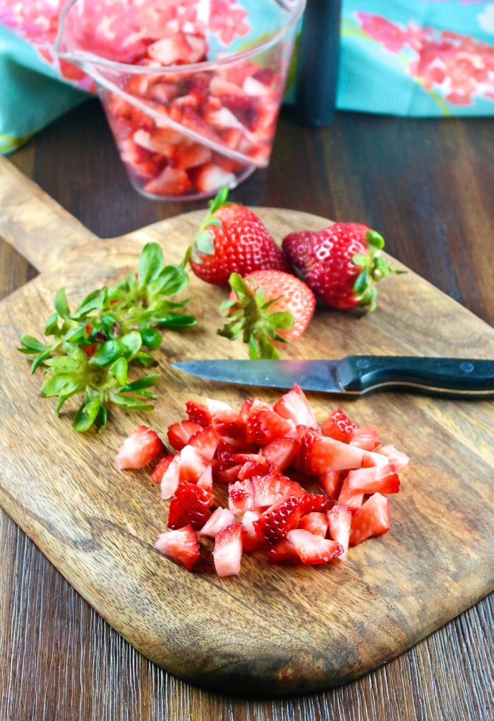 Clean and dice strawberries