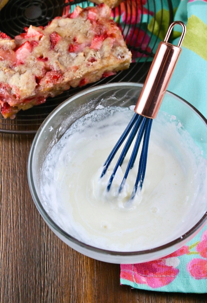 Preparing a light glaze to go over the strawberry bread