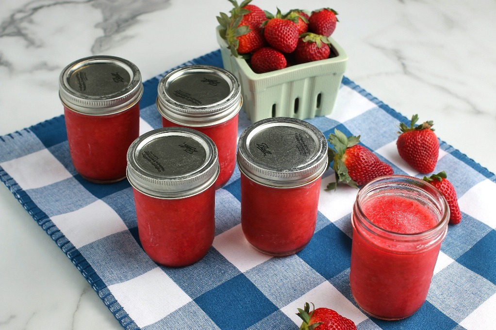 A horizontal view of the finished jars of strawberry freezer jam low sugar ready to eat!