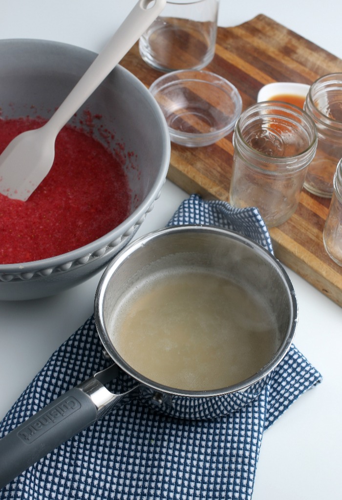 Now that the gelatin is mixed up we can add it to our berry mixture before the freezer jam goes into the glasses.