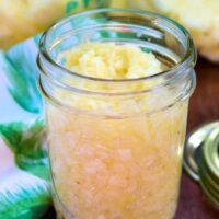 Homemade crushed pineapple in a small mason jar.