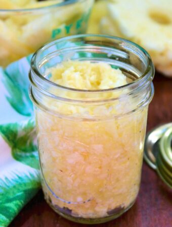Homemade crushed pineapple in a small mason jar.