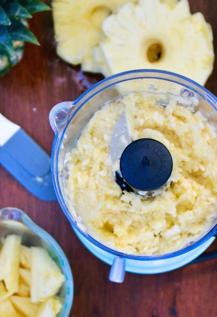 Pineapple chunks in a food processor crushed.