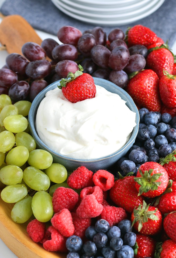 Here we see the finished fruit dip recipe on a tray with delicious fresh fruits.