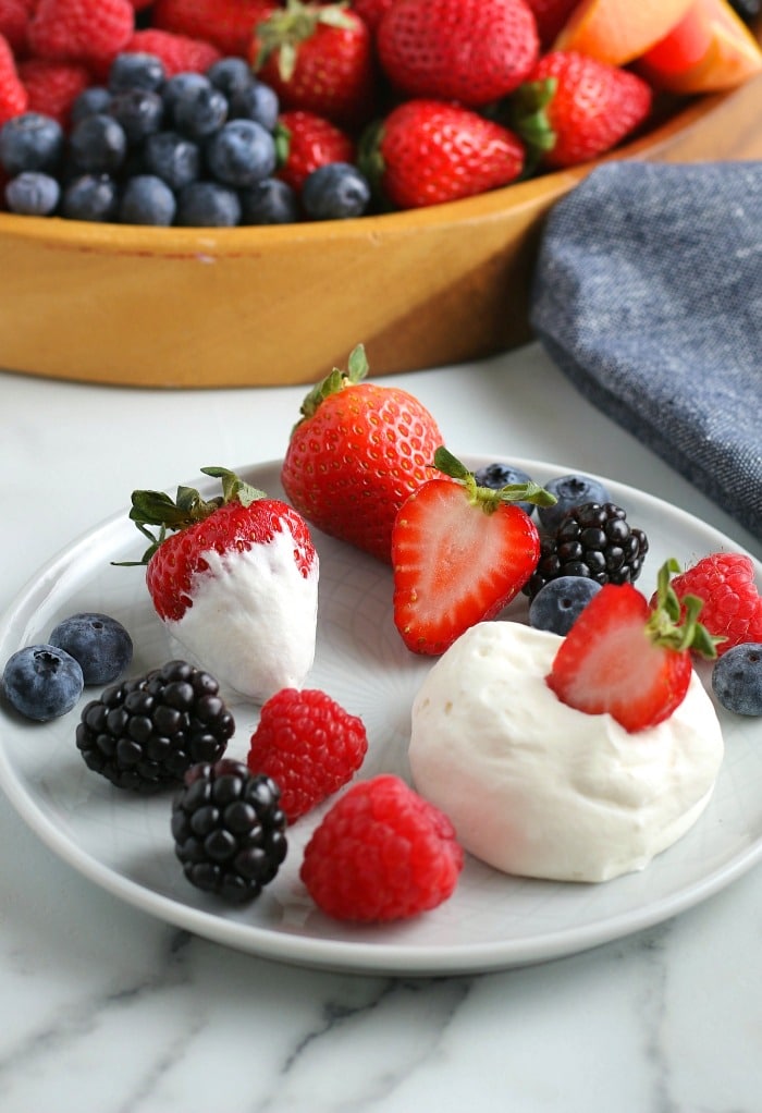 This photo shows the finished recipe on a plate with a serving of fruit ready to be enjoyed. 