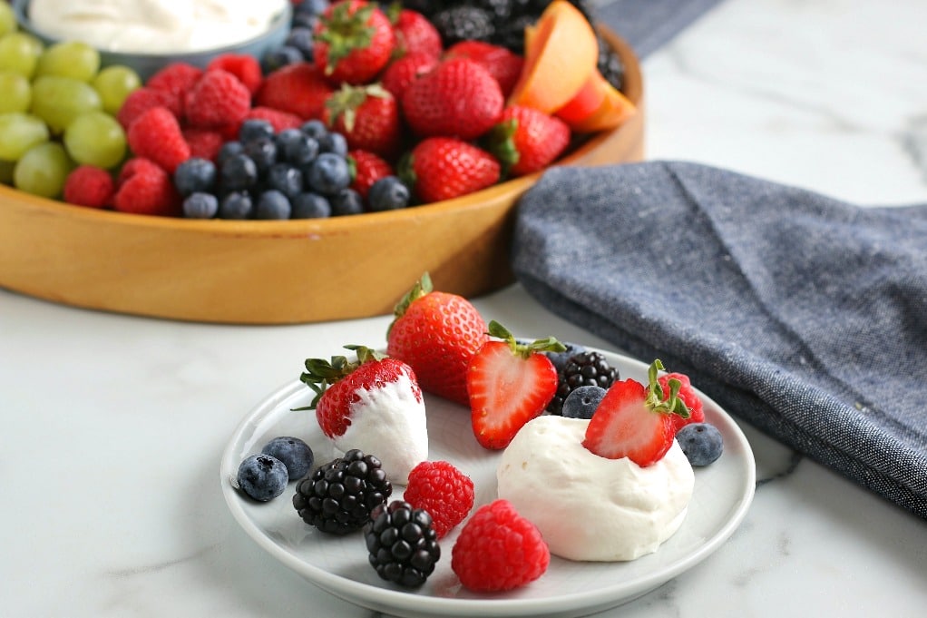 Horizontal image showing the finished easy fruit dip served up and ready to be eaten. 