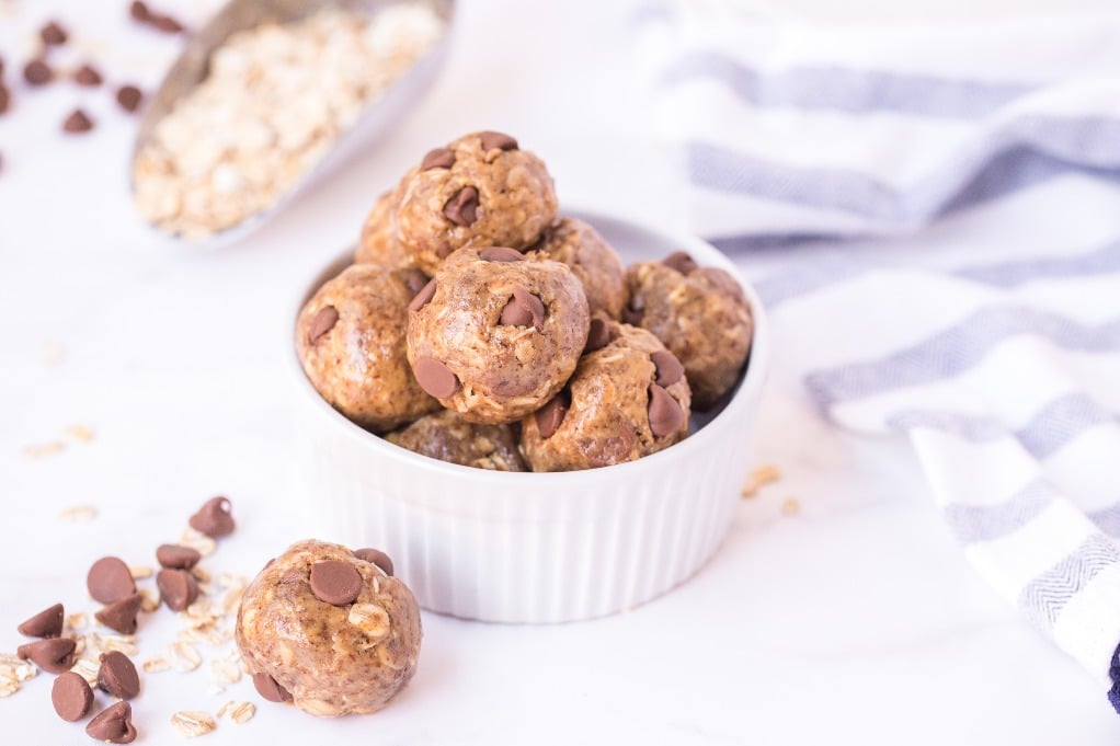 horizontal shot of energy balls in a small white bowl. 