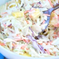 Pineapple coleslaw in a white bowl ready to be served.