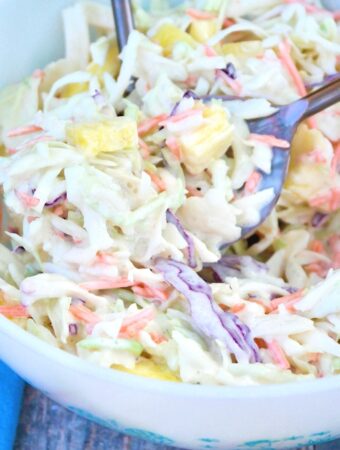 Pineapple coleslaw in a white bowl ready to be served.