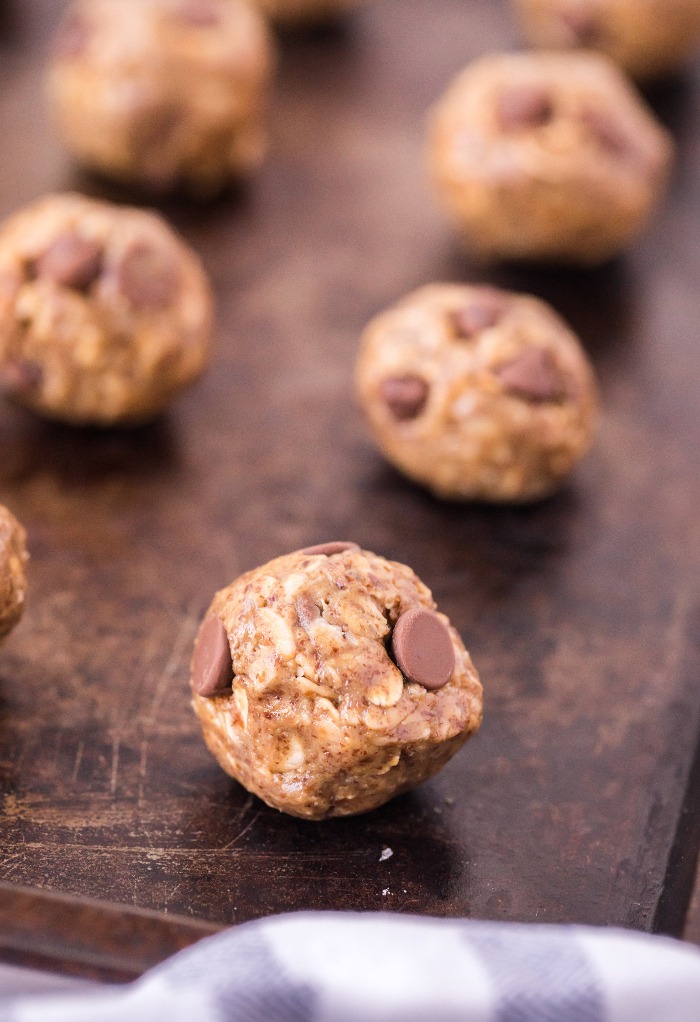 Energy balls shaped and placed on a baking sheet. 