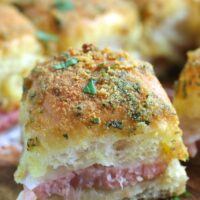 A close up shot of one single hamd and cheese sliders without poppyseeds ready to be shared or eaten.