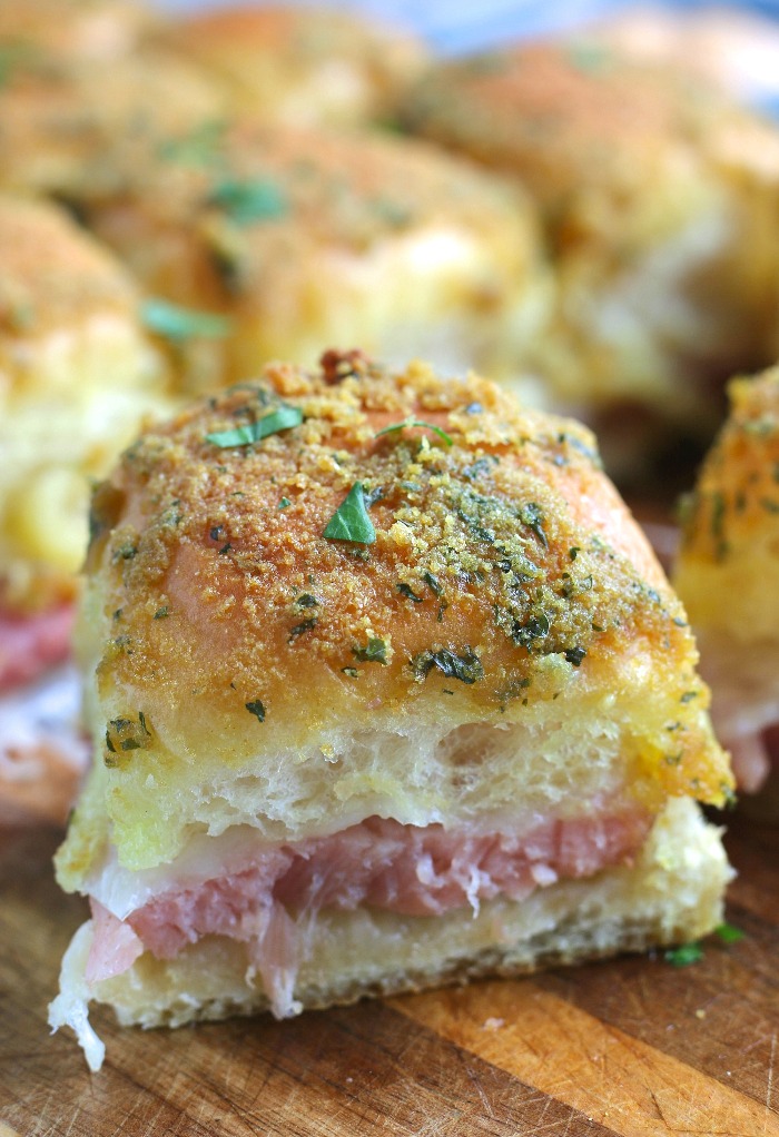 A close up shot of one single hamd and cheese sliders without poppyseeds ready to be shared or eaten. 