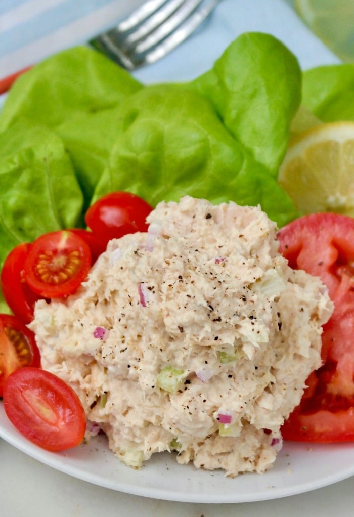 Low carb tuna salad with tomatoes on a white plate.