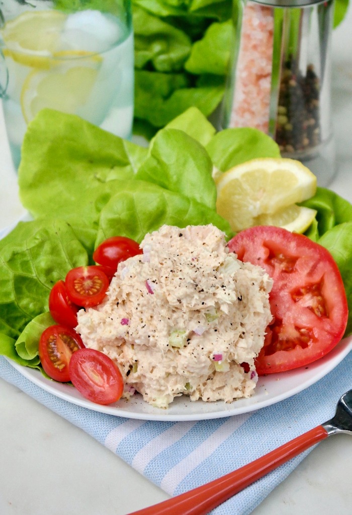 A scoop of keto tuna salad on a white plate ready to eat. 