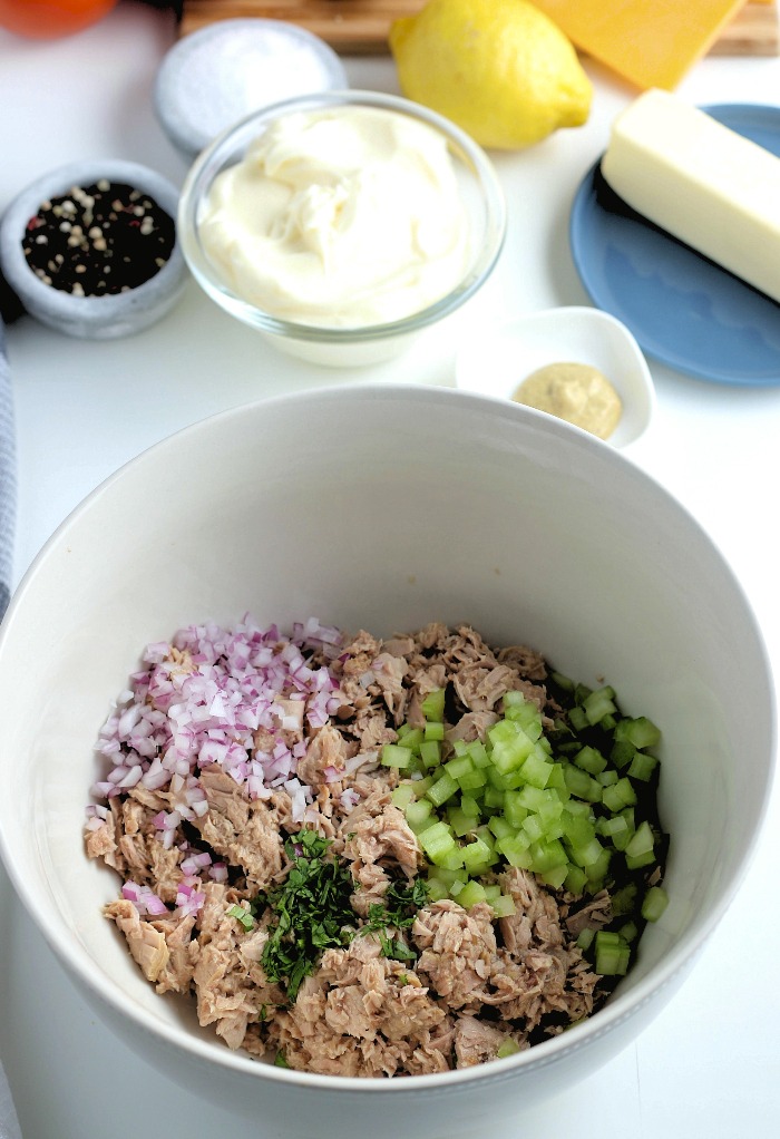 Tuna salad ingredients in a large mixing bowl.