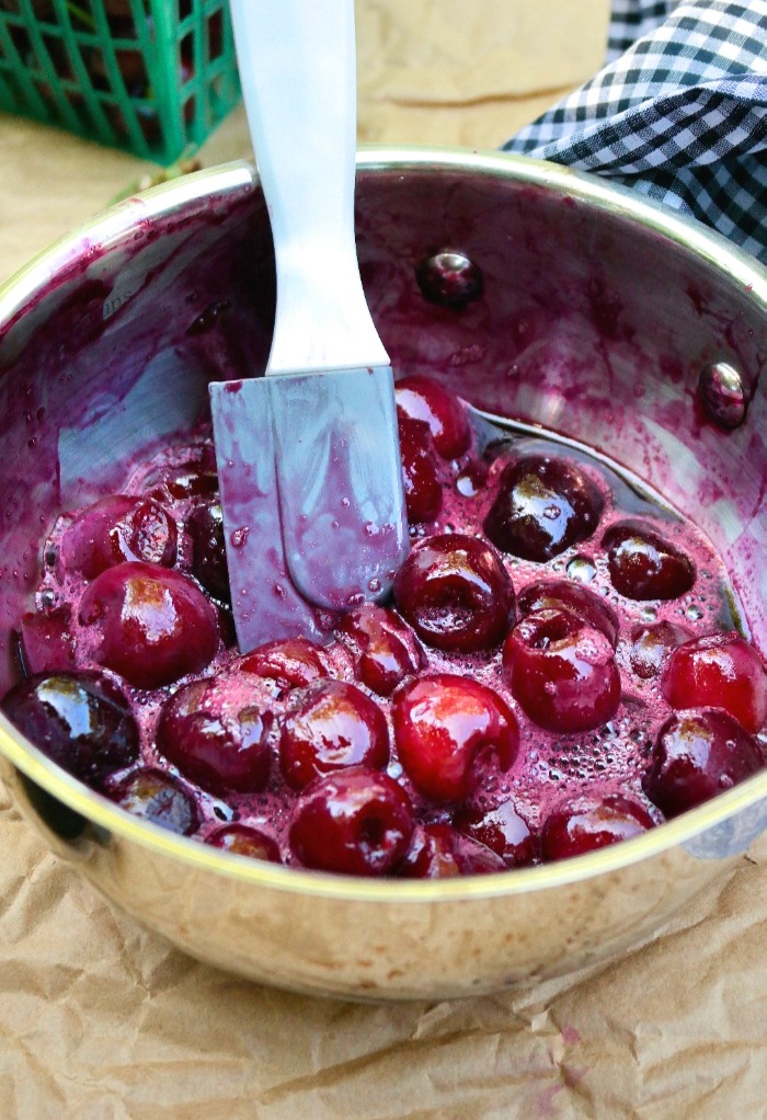 Fresh cherries simmered to make a syrup for mojitos