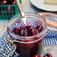 Homemade cherry compote in a glass jar